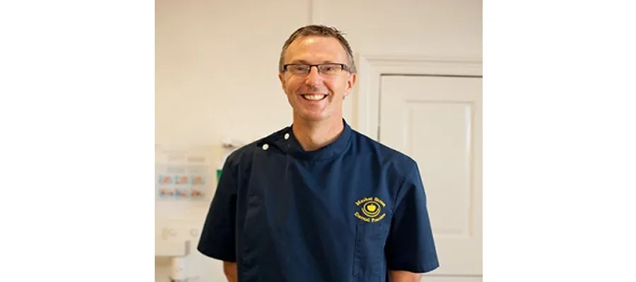 Scott Williamson in dentist lab coat